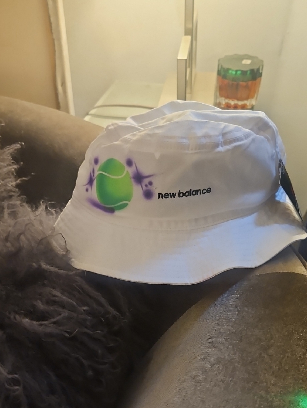 New Balance White Bucket Hat with Neon Green Tennis Motif and Purple Accent. NWT